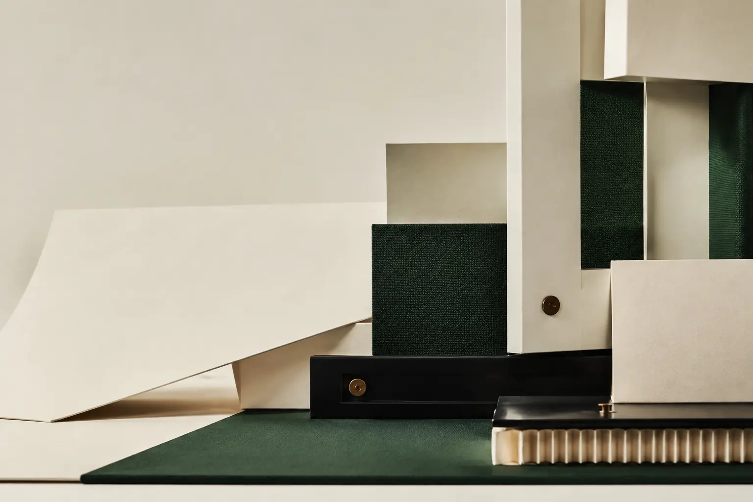 An abstract architectural arrangement in UNIMOD Forest, Warm Ivory and Carbon tones